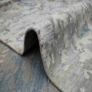 Hand-knotted wool rug featuring faded abstract pattern in navy slate blue grey, 8x10 feet