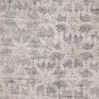 Hand-knotted wool rug featuring faded geometric and floral pattern in grey, beige, 8x10 size.