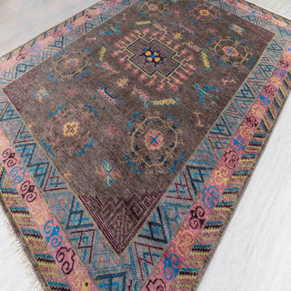 Hand-knotted wool rug featuring geometric Oushak medallion and tribal motifs in chocolate, teal, fuchsia, 9x12.