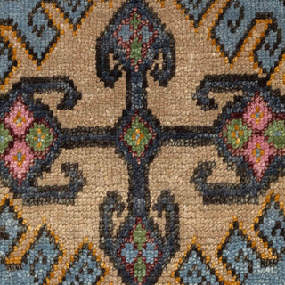 Hand-knotted wool rug featuring hexagon medallion and tribal pattern in rust, blue, green, 8x10.