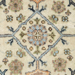 Hand-knotted wool rug featuring intricate Oushak floral and vine pattern in ivory, blue, grey, 8x10 size.