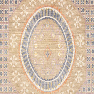 Hand-knotted wool rug featuring intricate circular medallion and linear pattern in gold, blue, 9x12 size.