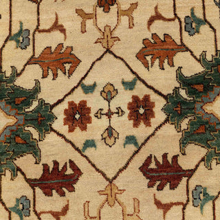 Hand-knotted wool rug featuring ivory field, rust border, Persian floral vines and motifs