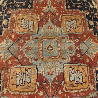 Hand-knotted wool rug featuring large central medallion, tribal motifs in rust, blue, gold, 9x12