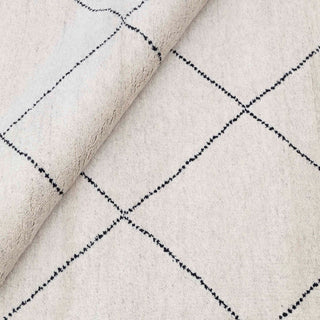 Hand-knotted wool rug featuring minimalist Moroccan diamond pattern in ivory, black lines, 9x12.