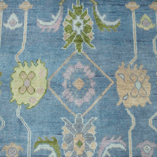 Hand-knotted wool rug featuring modern Oushak floral pattern in pastel blue, pink, green, 8x10