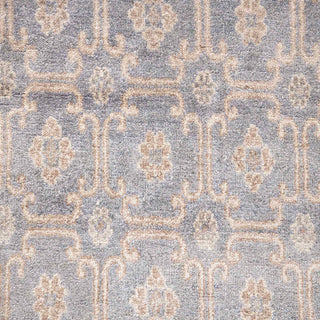 Hand-knotted wool rug featuring small floral lattice pattern in blue, cream, taupe, 8x10 size.