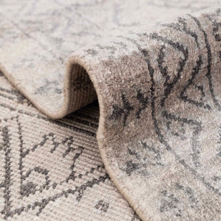 Hand-knotted wool rug featuring small geometric floral pattern in grey, beige, 8x10 size.