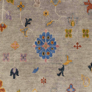 Hand-knotted wool rug featuring taupe field with colorful floral and boteh motifs in orange, yellow, blue, purple, 8x10 size
