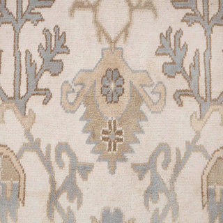 Hand-knotted wool rug featuring traditional Oushak floral pattern in ivory, light blue, beige, 10x14