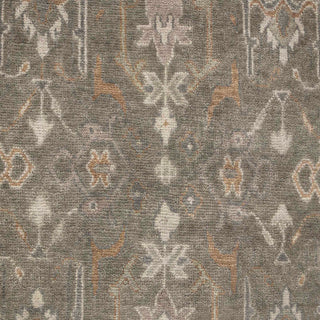 Hand-knotted wool rug featuring traditional Oushak motifs in muted gray, beige, sage, 9x12 area.

