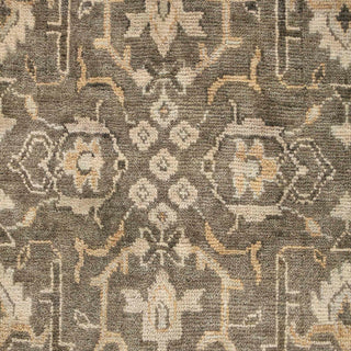 Hand-knotted wool rug featuring traditional Oushak pattern in olive, sand, gray tones, 8x10 size.