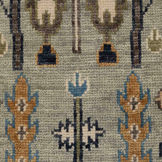 Hand-knotted wool rug featuring tree-of-life garden pattern in sage, ivory, blue, gold, 8x10 size