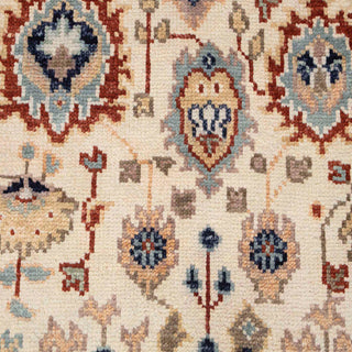 Hand-knotted wool rug featuring tribal Oushak pattern in ivory, rust, blue, 9x12 area rug.