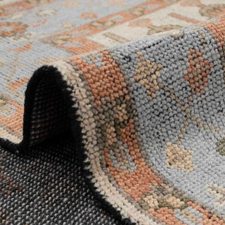 Hand-knotted wool rug featuring vertical tree-of-life floral pattern in ivory, blue, rust, 8x10 size