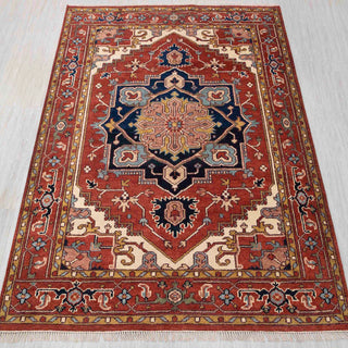 Hand-knotted wool rug in brick red, navy, ivory with bold central medallion design, 8x10.