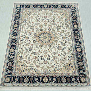 Hand-knotted wool rug in ivory and navy with detailed Persian floral medallion design