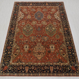 Hand-knotted wool rug in rust, black, and beige with intricate floral medallion design, 8x10.
