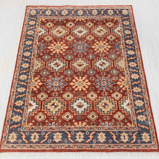 Hand-knotted wool rug in rust, blue, beige with allover geometric tribal design, 8x10.
