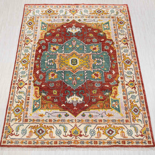 Hand-knotted wool rug in rust, teal, ivory with geometric medallion design, approx. 8x10.