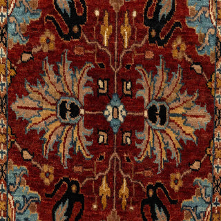 Hand-knotted wool runner featuring classic floral and vine pattern in rust field with navy border, 2.6x10 ft.