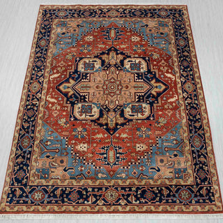 Heriz-style hand-knotted rug in rust, navy, and beige with bold central medallion design, 8x10.