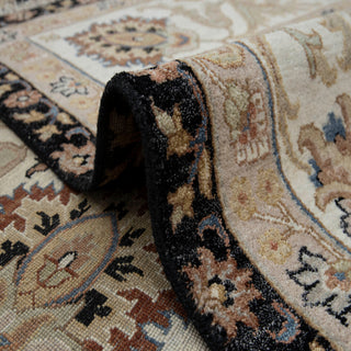 Heriz-style hand-knotted rug with palmette floral motif in navy ivory rust, 10x14 area.