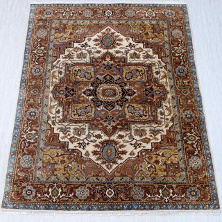 Heriz hand-knotted rug in rust, ivory, blue with central medallion design, 8x10 area size.