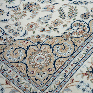 Isfahan-style hand-knotted rug with classic floral medallion motif in ivory, blue, tan tones. silk living room rugs