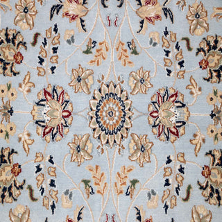 Isfahan-style hand-knotted rug with intricate allover floral motifs in soft blue, cream, gold tones