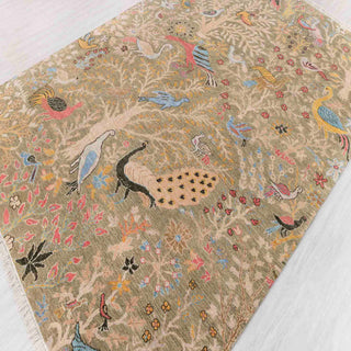 Kashmiri-style hand-knotted rug with paradise garden bird motifs in sand, pastel tones, 6x9