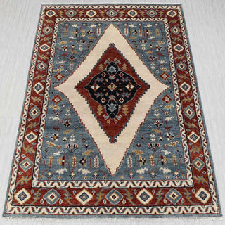 Kazak hand-knotted rug in blue, rust, ivory with diamond medallion design, 8x10 size.