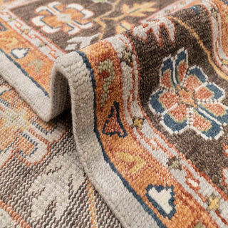 Large 12x15 hand-knotted area rug with ornate central medallion, floral border, blue and rust palette