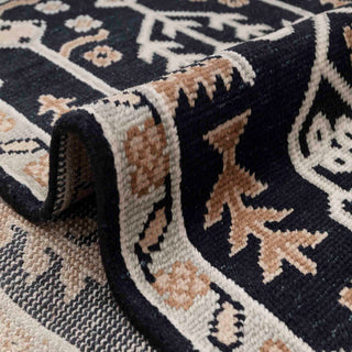 Large 9x12 living room rug, low pile wool, dark ground, high-contrast tribal floral statement carpet.