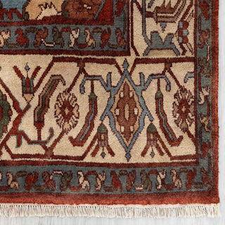 Modern classic hand-knotted rug with stepped medallion and botanical border pattern in rust, navy, beige.