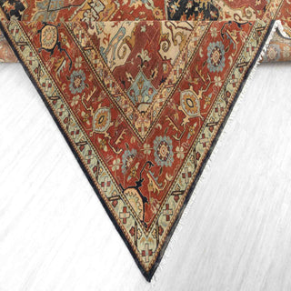 Modern classic hand-knotted wool rug with angular medallion pattern in rust, aqua, navy tones, 9x12