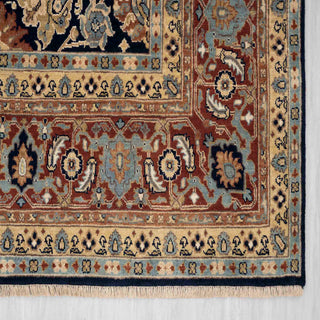 Modern classic hand-knotted wool rug with curvilinear floral pattern in navy, rust, beige tones