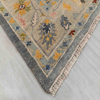 Modern hand-knotted rug with abstract Oushak-inspired pattern in charcoal grey and soft pastels