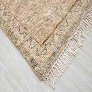 Modern hand-knotted rug with abstract Oushak-inspired pattern in washed beige, gray, blush neutrals.