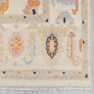 Modern hand-knotted rug with abstract Oushak pattern in ivory background and multicolor accents, 9x12 area