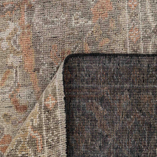 Modern hand-knotted rug with abstract distressed pattern in charcoal, warm rust, beige hues.