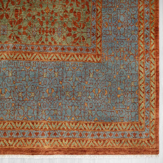 Modern hand-knotted rug with abstract geometric medallion in rust, sky blue, and sage, durable wool 9x12.