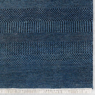 Modern hand-knotted rug with abstract linear and dotted pattern in layered navy, teal blues.