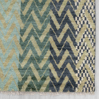 Modern hand-knotted rug with abstract linear chevron stripes in green, teal, blue, ideal living room.