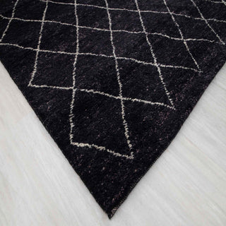 Modern hand-knotted rug with abstract linear diamond pattern in charcoal and ivory tones, for living rooms.