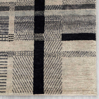 Modern hand-knotted rug with abstract linear grid pattern in beige and black, ideal living room decor