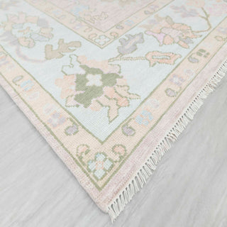 Modern hand-knotted rug with abstract pastel Oushak pattern in blush field and aqua border, 9x12 area

