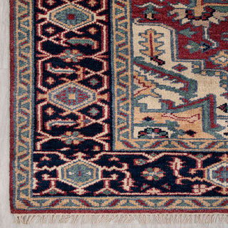 Modern hand-knotted rug with bold geometric medallion and lattice border pattern in navy, rust, teal, 8x10.
