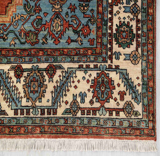 Modern hand-knotted rug with bold geometric medallion pattern in rust, navy, cream, 8x10.