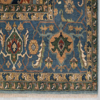Modern hand-knotted rug with bold geometric pattern in blue, rust, tan for large living rooms.